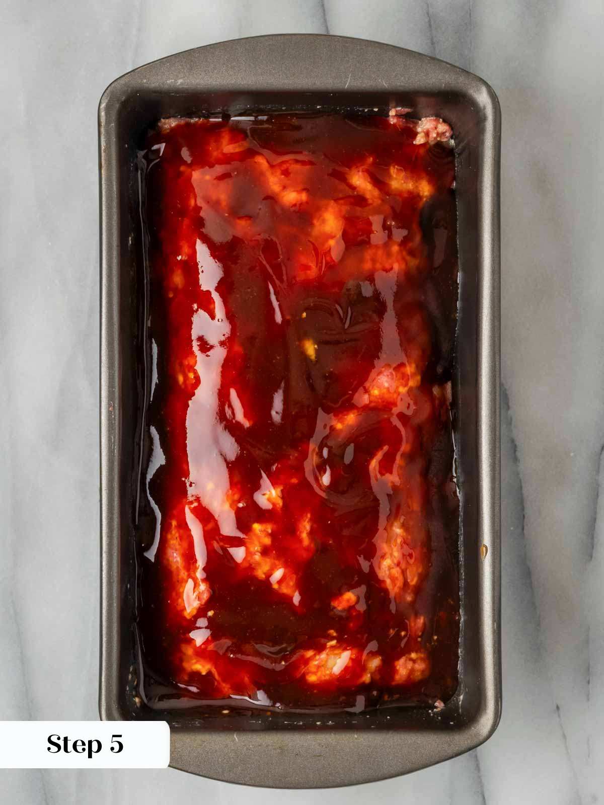 unbaked glazed meatloaf in pan.