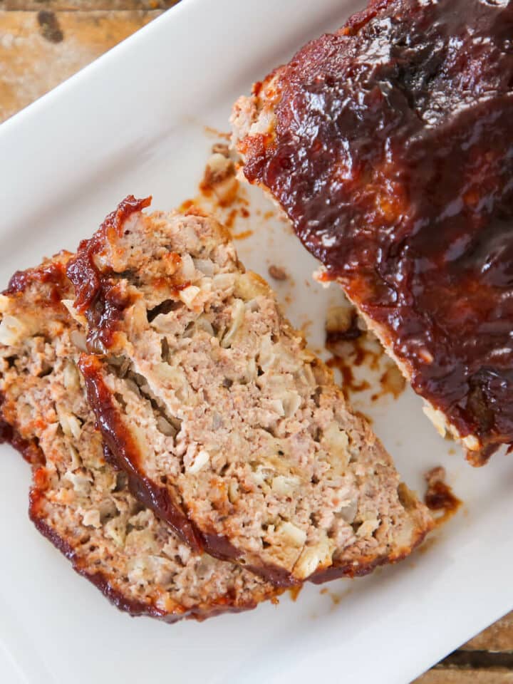 The best meatloaf sliced on white plate detailed texture