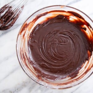 Chocolate Fudge Glaze in bowl with whisk