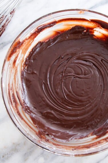 Chocolate Fudge Glaze in bowl with whisk