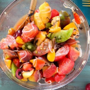 Marinated Tomato Stone Fruit Salad in mixing bowl