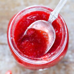 Quick Strawberry Jam in jar with spoon