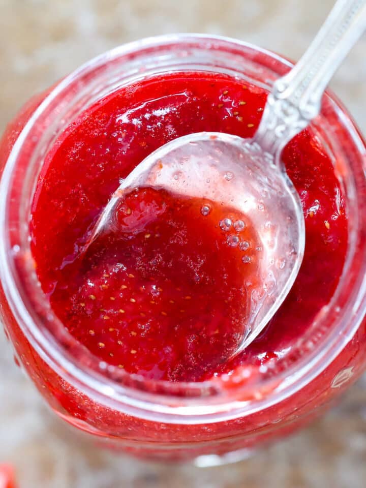 Quick Strawberry Jam in jar with spoon