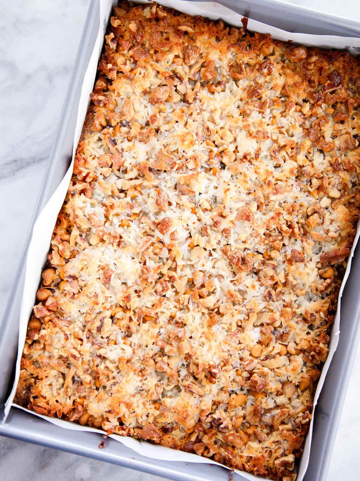 unsliced pan of baked 7 layer bars.