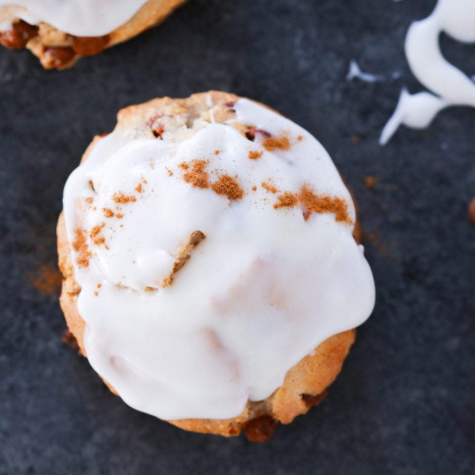 Cinnamon scone with a cream cheese glaze on top.