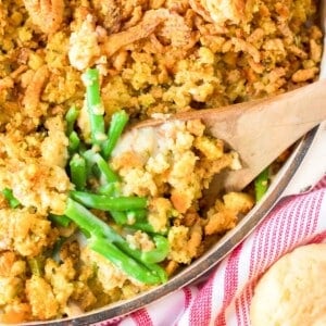 green bean casserole with wooden spoon.