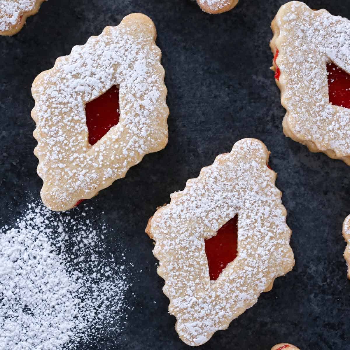 sandwich cookies in diamond shape with raspberry jam filling.