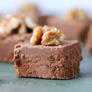 sliced fudge square with walnut on top.