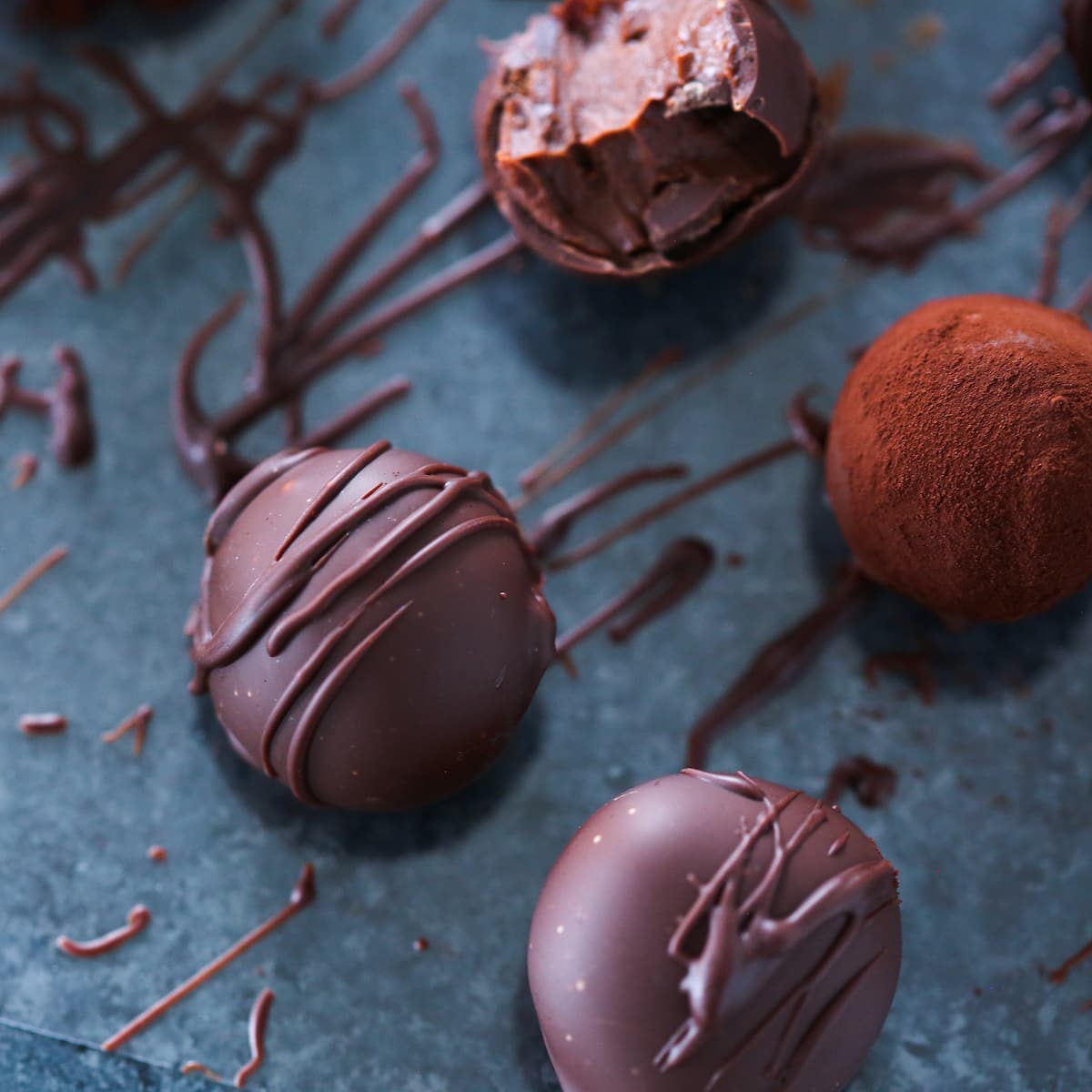 https://cheflindseyfarr.com/wp-content/uploads/2022/02/bourbon-dark-chocolate-truffles-enrobed-featured.jpg