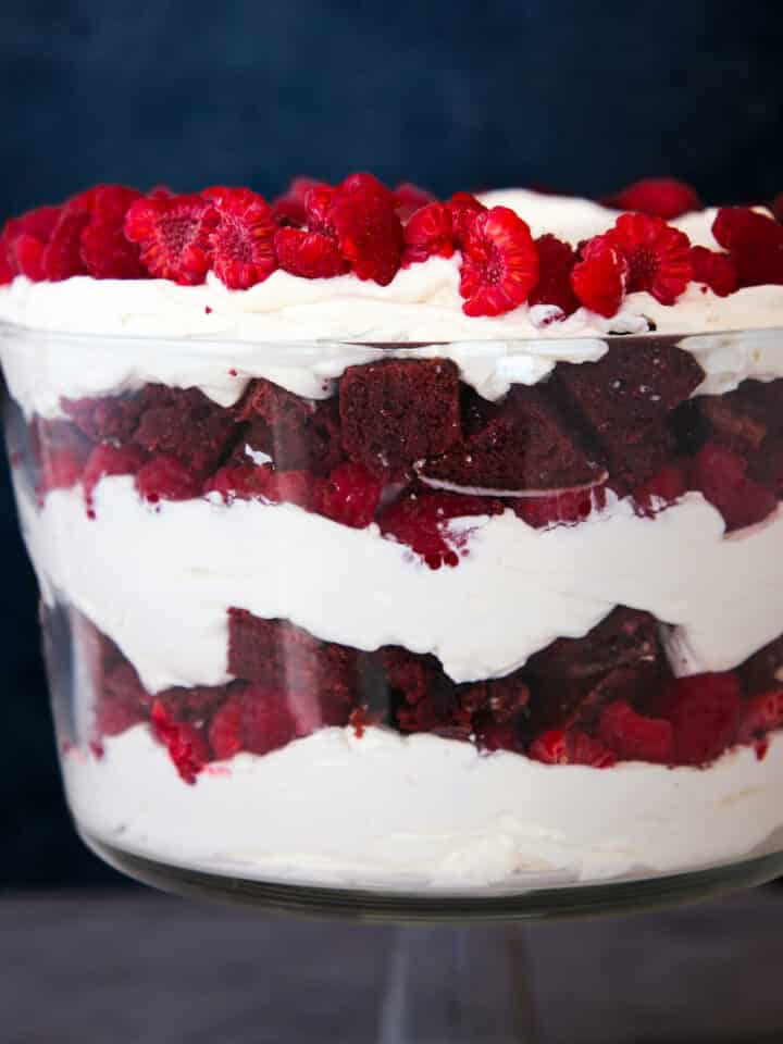 Red Velvet Raspberry Trifle in trifle dish from side