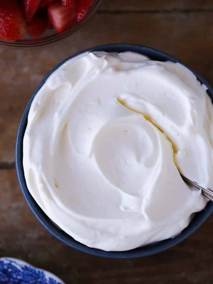 Lemon Whipped Cream in a blue bowl with vintage spoon