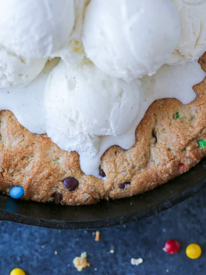 Monster Skillet Cookie with vanilla ice cream in skillet