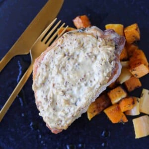 Mustard Crusted Pork with sweet potatoes on blue plate