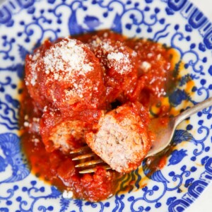 Ricotta Meatballs with red sauce on blue plate