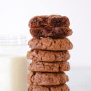 Triple Chocolate Chip Cookies Stacked next to milk