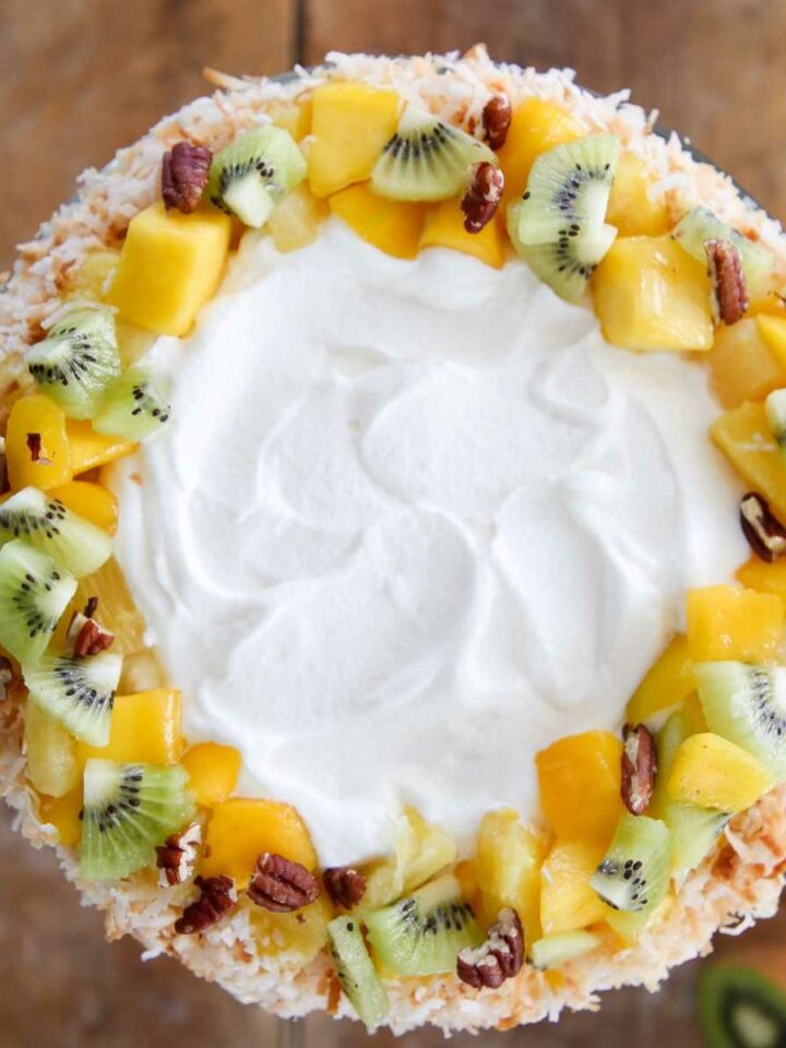 Tropical Fruit Trifle decorated with fresh fruit pecans coconut