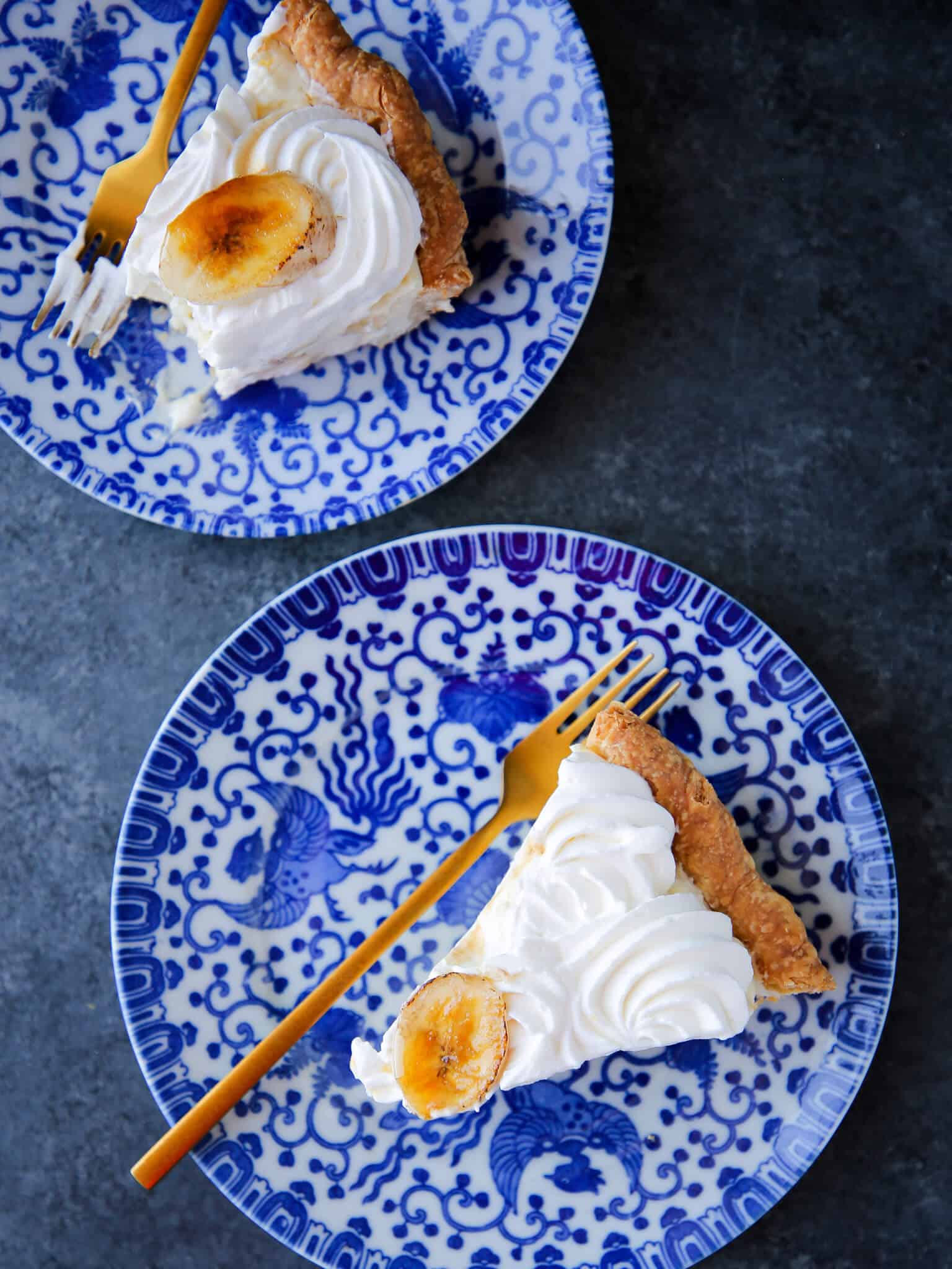 Banana Cream Pie slices on blue china plates