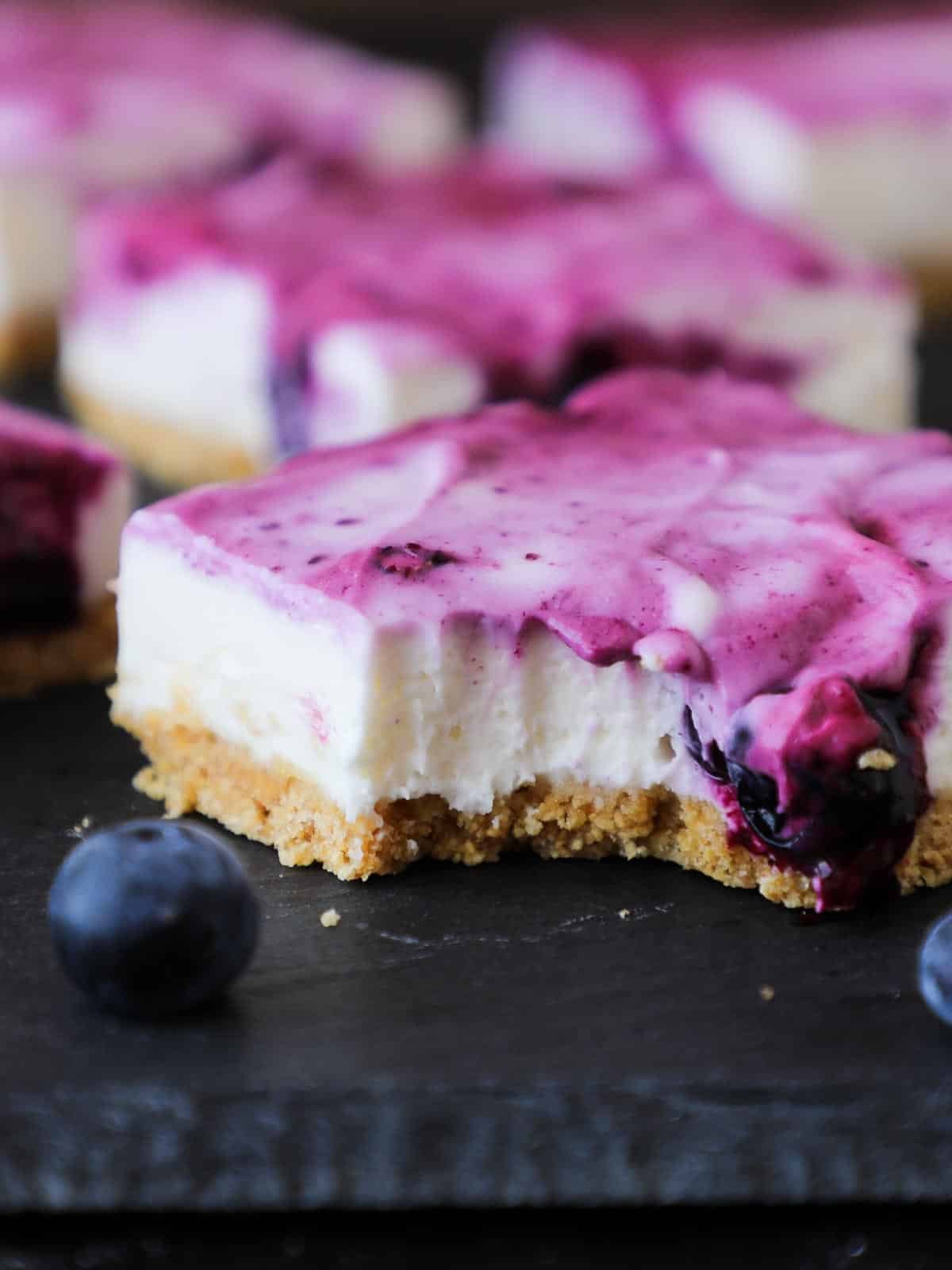 a bitten no bake blueberry cheesecake bar. 