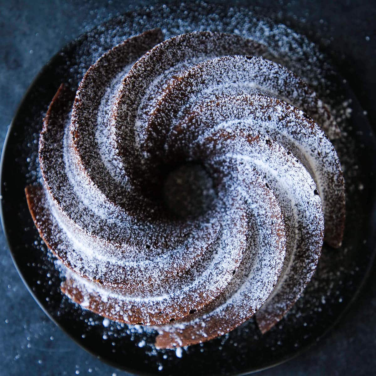 An uncut fluted chocolate pound cake.