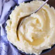 Creamy Mashed Potatoes Recipe with vintage spoon in blue bowl