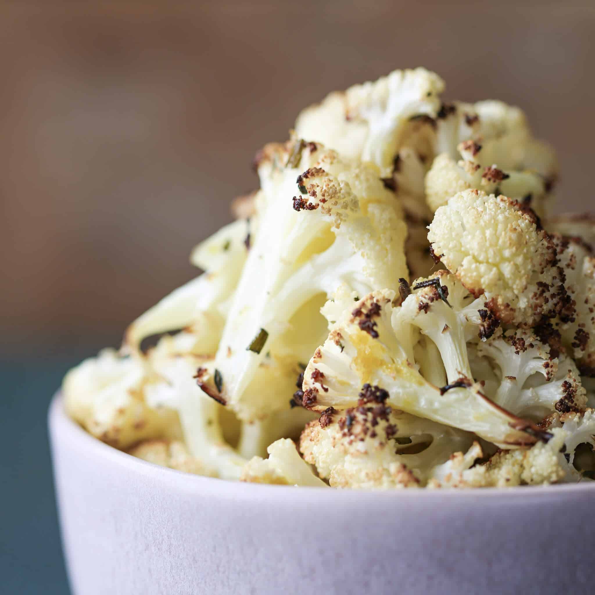 Easy Rosemary Lemon Roasted Cauliflower piled in bowl