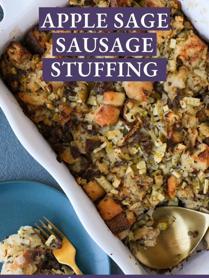 Apple Sage Sausage Stuffing with a serving being offered on a blue plate.