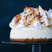 Lemon Meringue Cheesecake on vintage glass cake stand