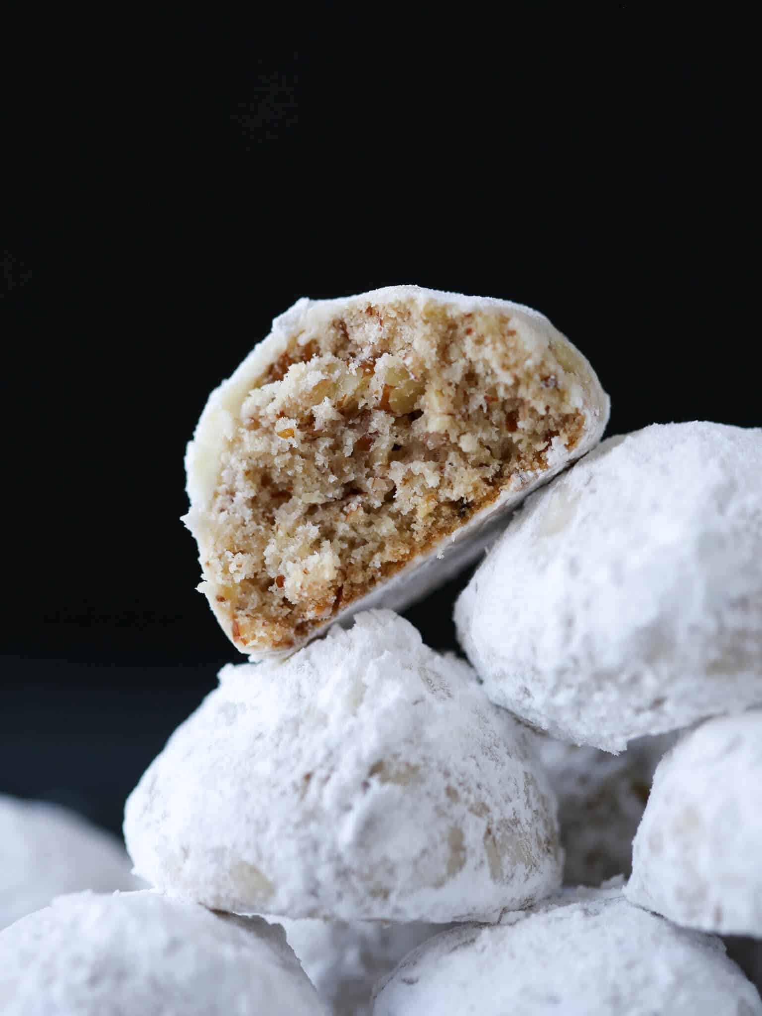 Pecan Snowball Cookies stacked cut open.