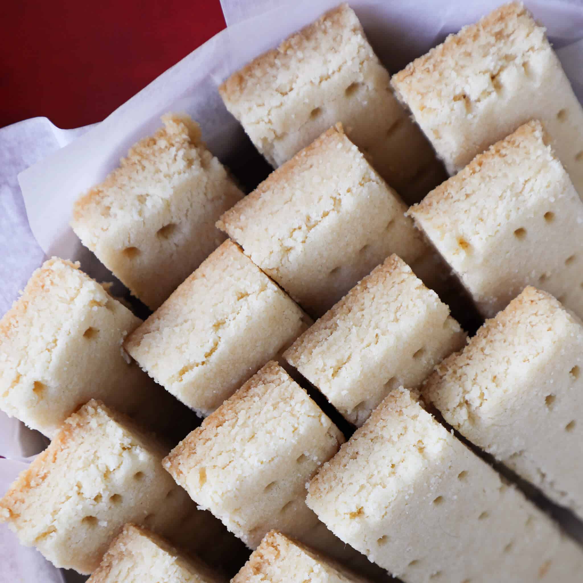 A group of scottish shortbread baked and placed in a basket.