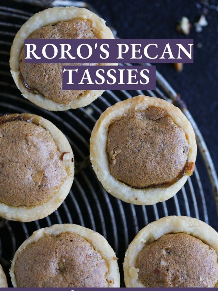 Pecan tassies with a perfectly baked brown top centered in a golden crust.
