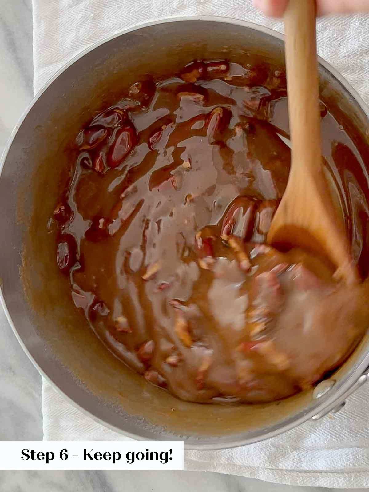 stirring pecans and candy mix. 