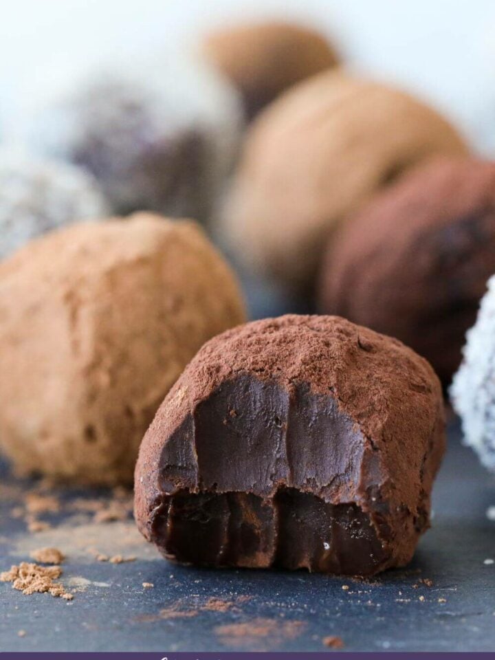 truffle covered in cocoa powder with bite.