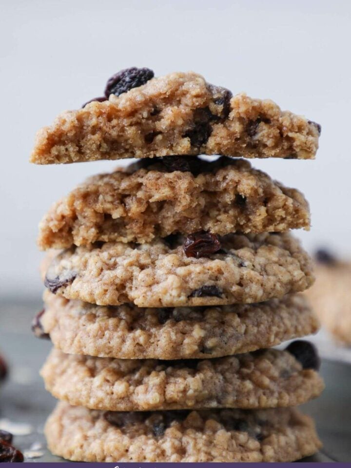 Old Fashioned Oatmeal Cookies stacked with some broken for view of chewy inside.