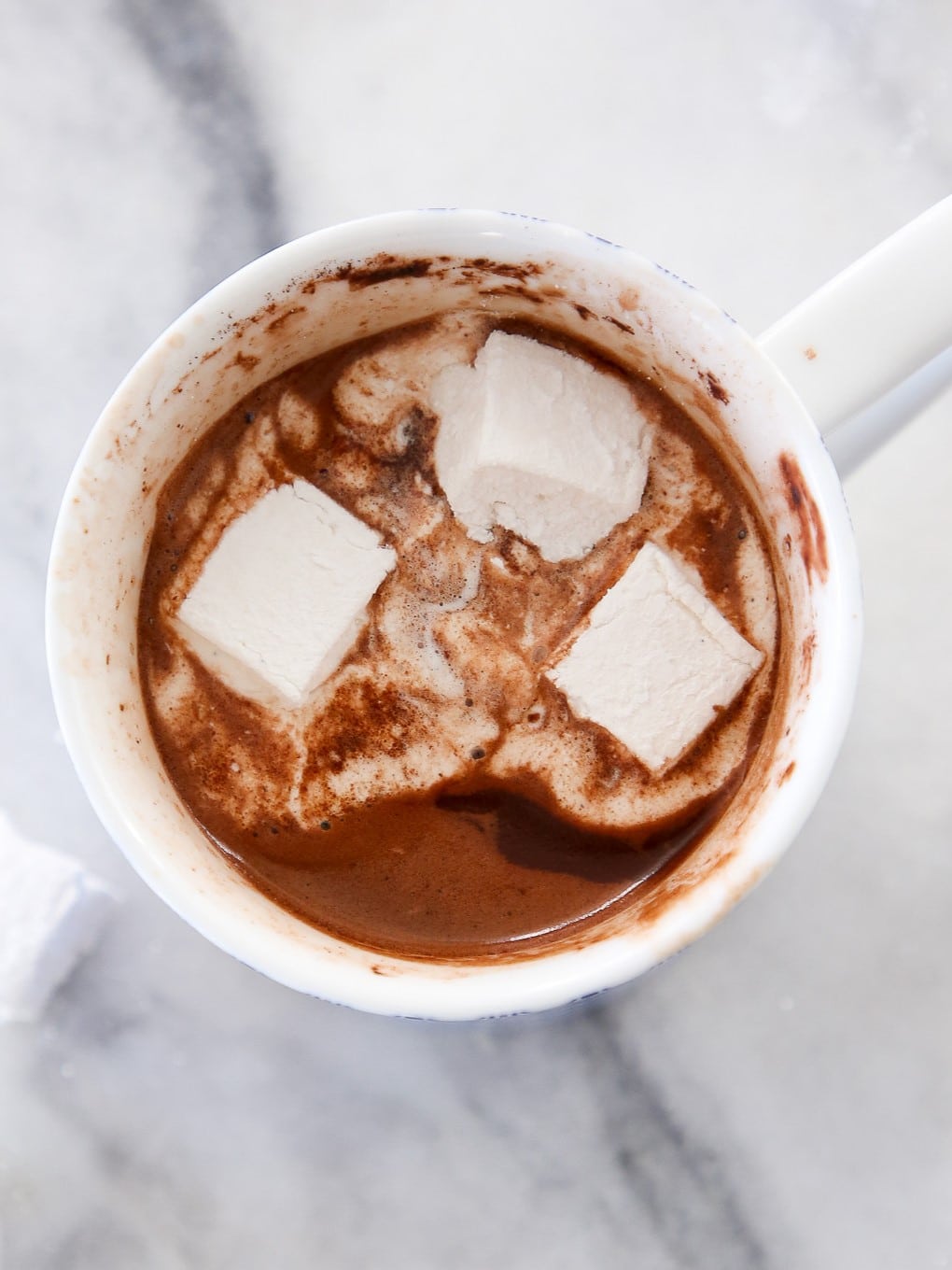 Easy chocolate dessert of homemade hot chocolate on white marble countertop.