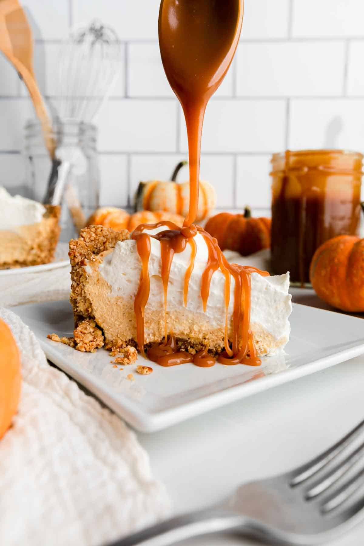 no bake pumpkin pie with caramel sauce pouring on.