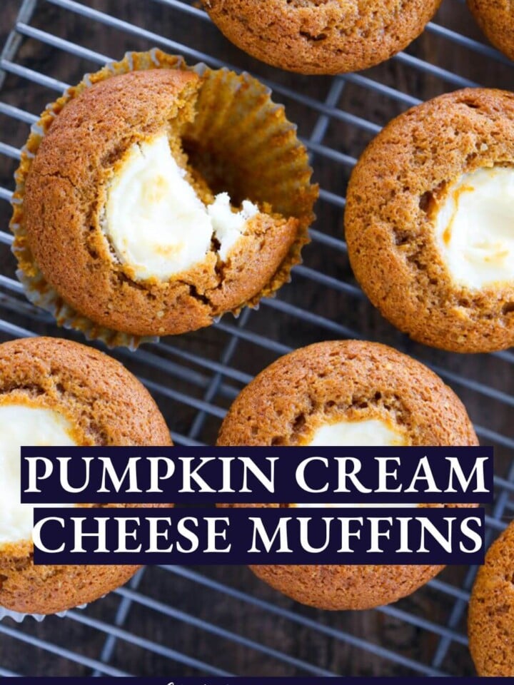 Pumpkin cream cheese muffins on a metal cooling rack.