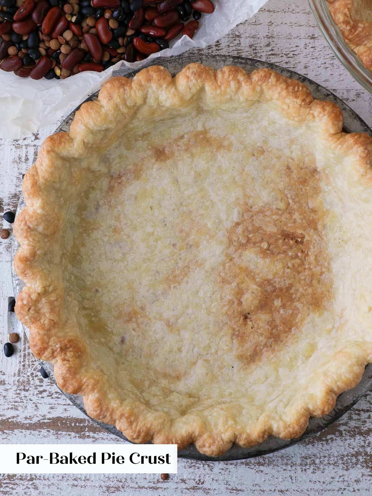 partially blind baked pie crust in tin.