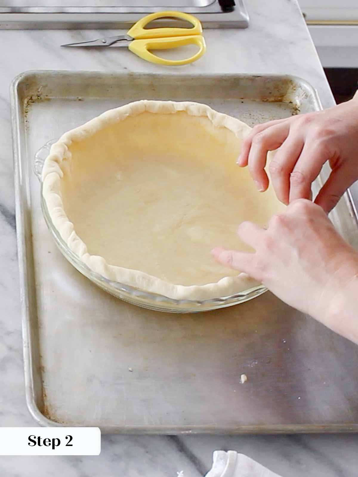 rolling edges of pie dough in single crust pie.