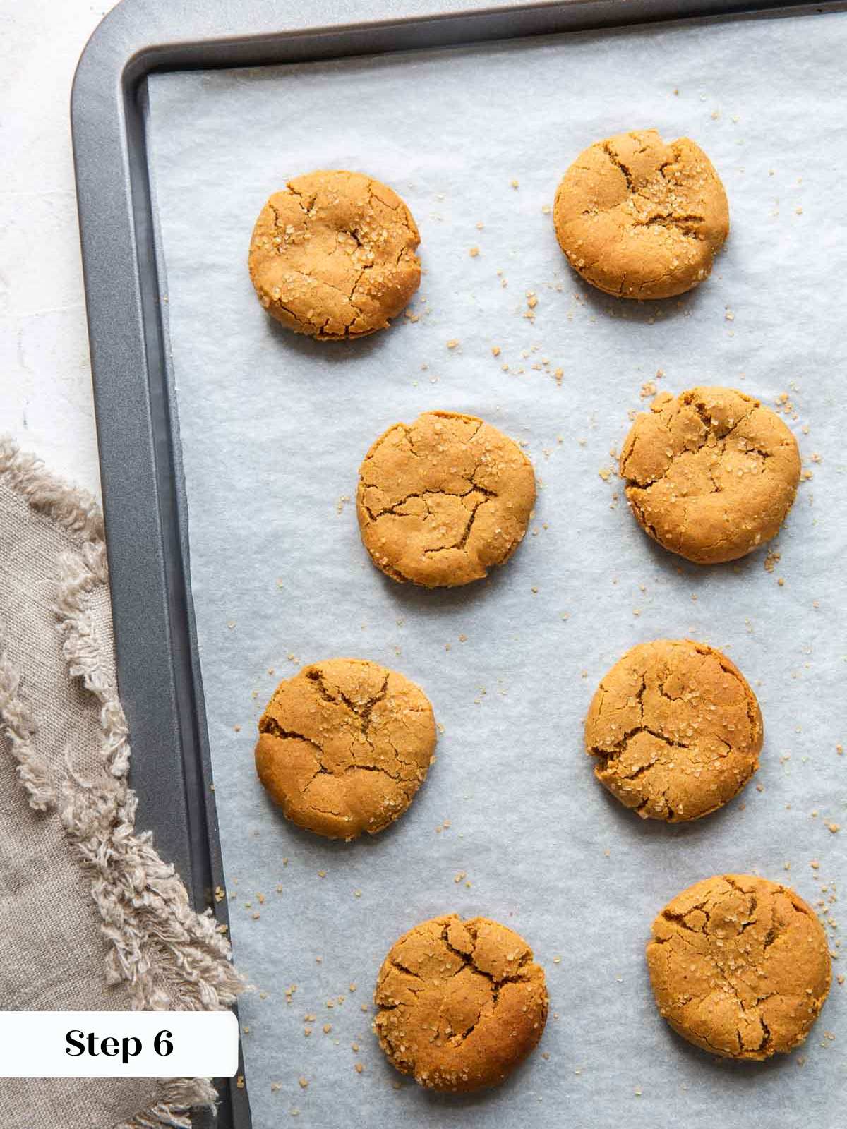 baked spice cookies on baking sheet with parchment.