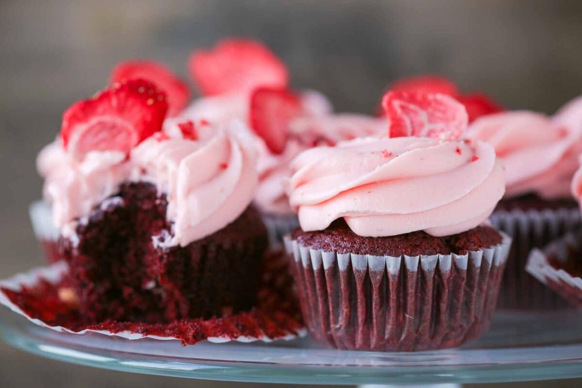 Red velvet cupcakes with pink frosting.