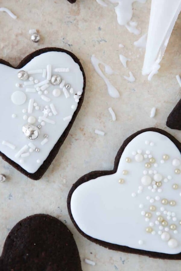 two iced sugar cookies.