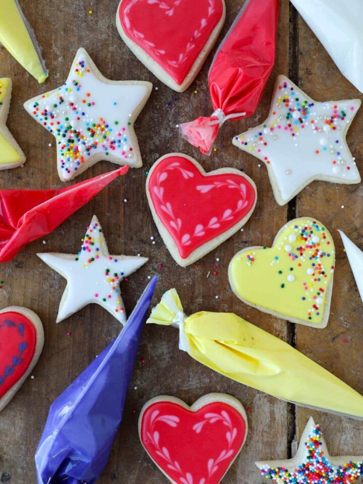 royal icing in bags with iced cookies.
