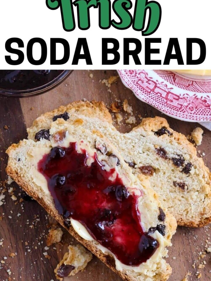 irish soda bread with jam and butter on slice.