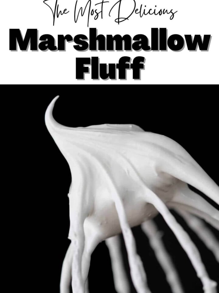 marshmallow fluff on whisk with black background.