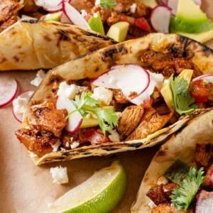 Chicken tacos with chopped chicken.