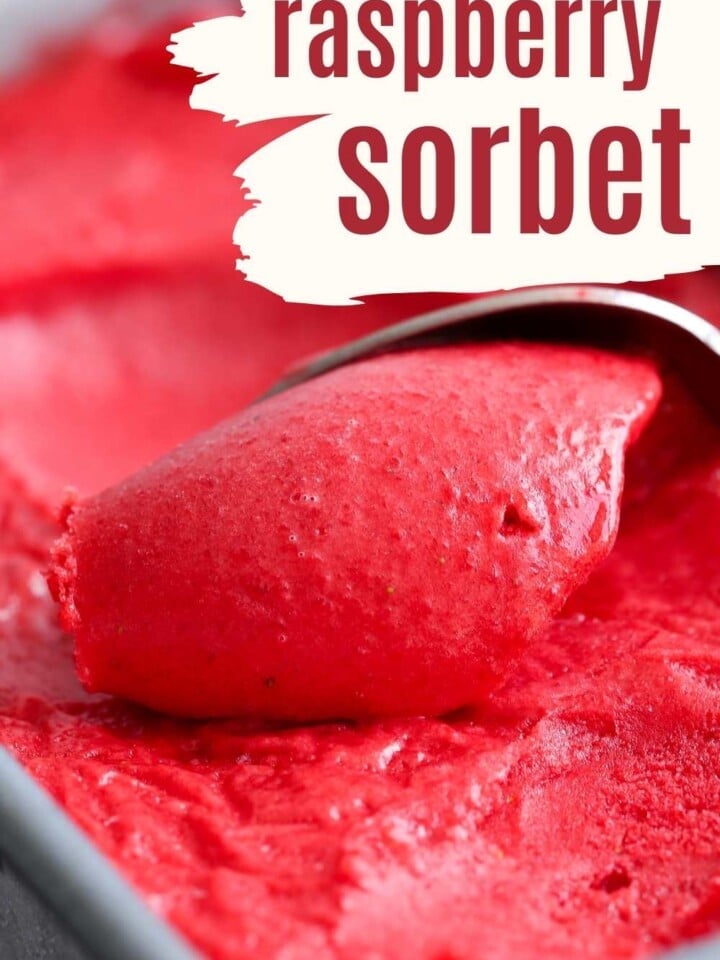 spoon scooping raspberry sorbet.