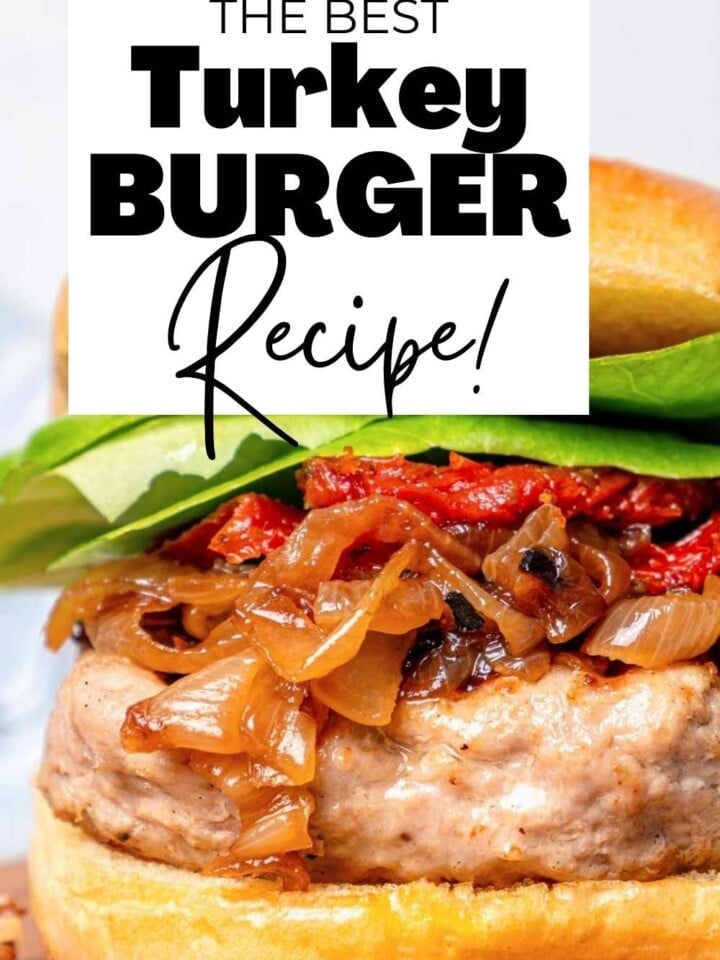 turkey burger on bun with lettuce, sun-dried tomatoes, and caramelized onions.