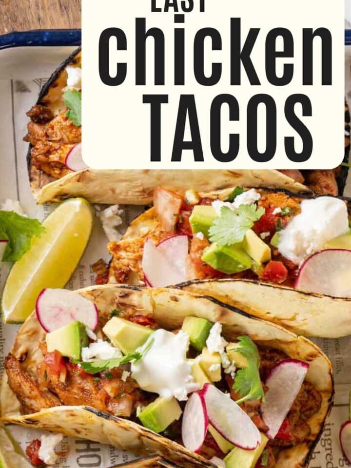 chicken tacos assembled on tray with text.