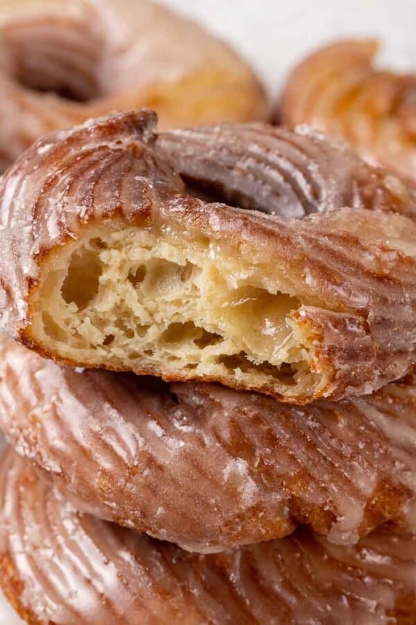cruller with bite to show interior.