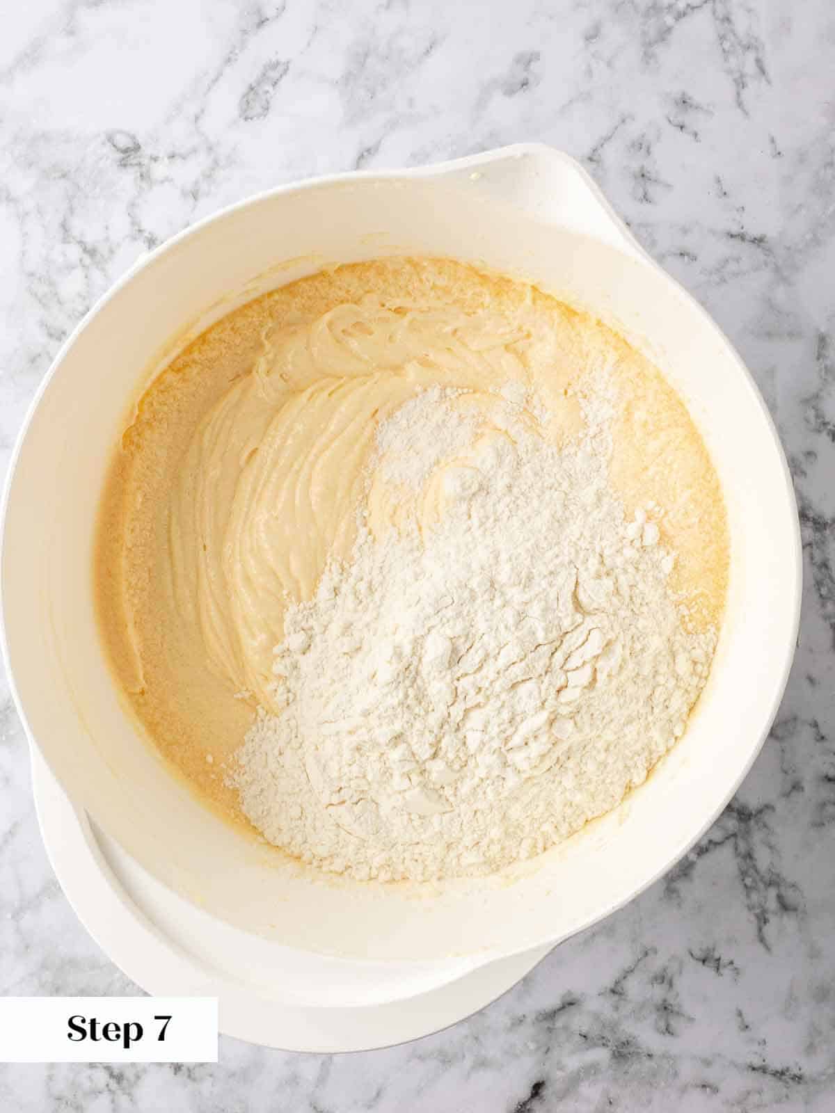 Mixing dry ingredients into the lemon pound cake batter.